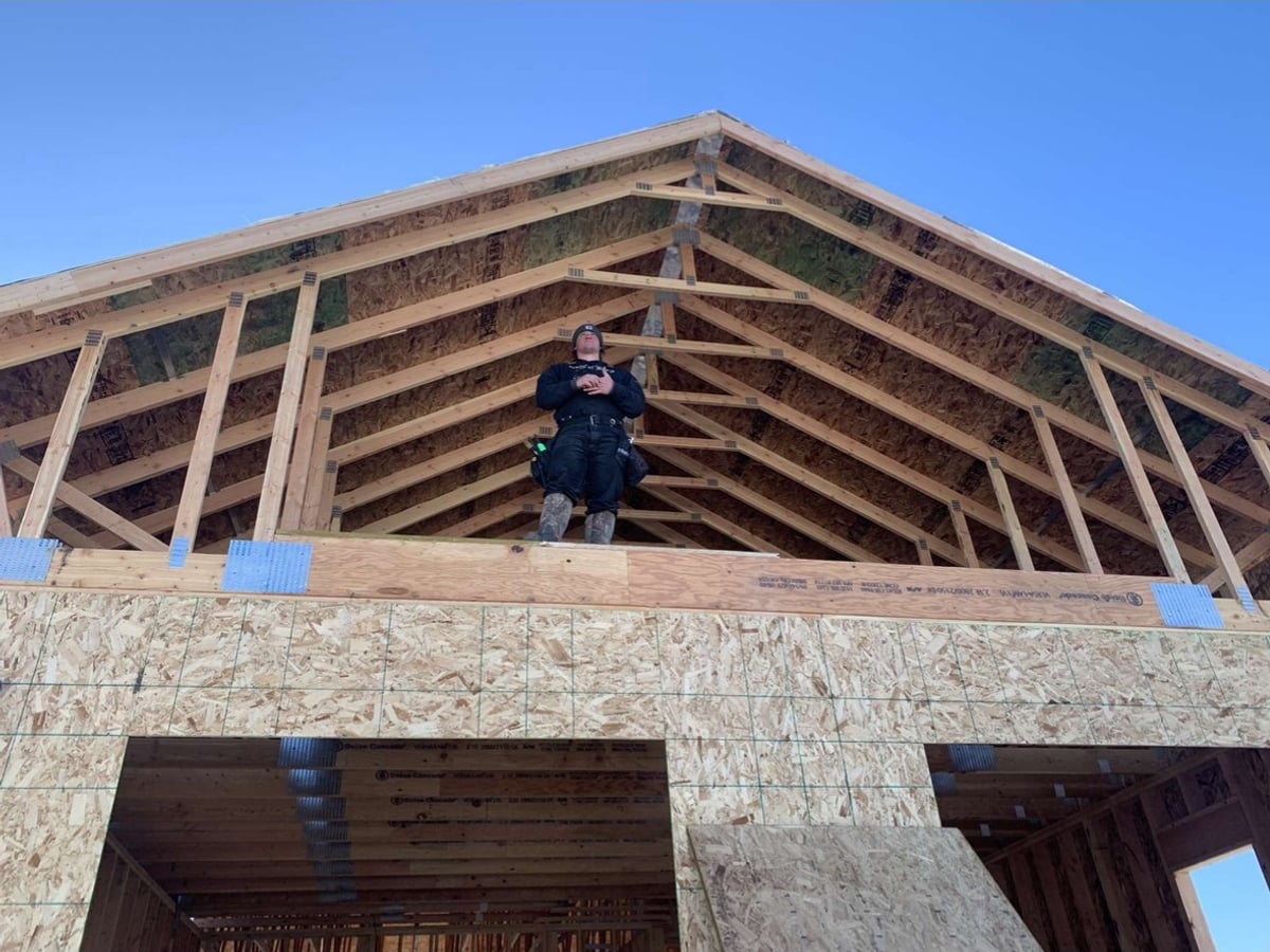 Roof framing with rafters and sheathing for custom home in Missoula, MT